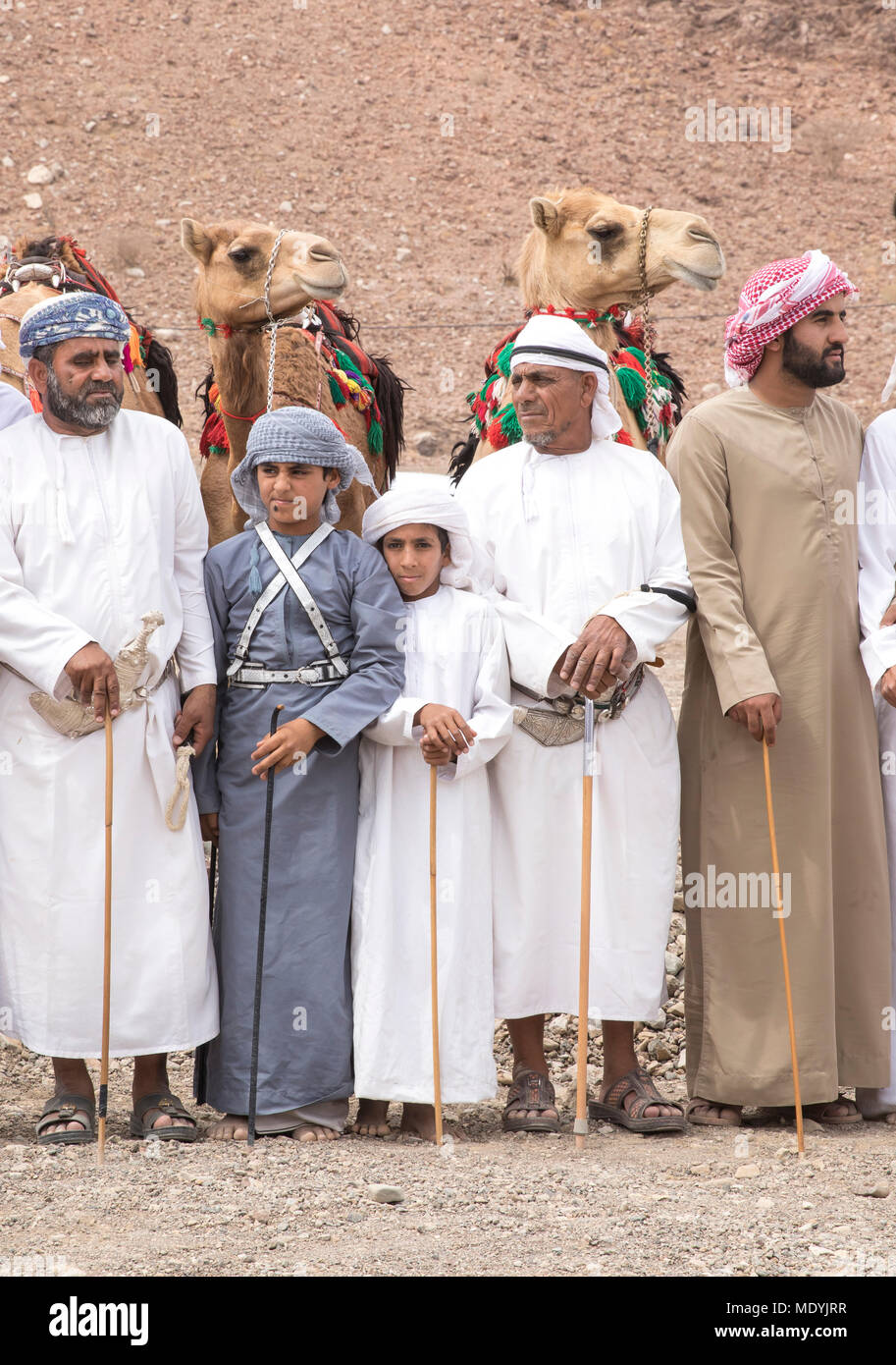 khadal, Oman,7th April 2018: omani men in traditional clothing, with their  camels, gathering to celebrate Eid Stock Photo - Alamy