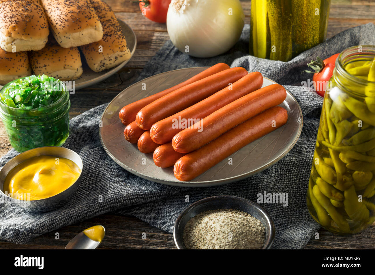 Chicago Style Hot Dog Ingredients with Mustard Pickles Relish Tomato and Peppers Stock Photo