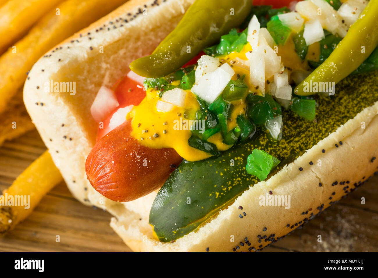 https://c8.alamy.com/comp/MDYKTJ/homemade-chicago-style-hot-dog-with-mustard-pickles-relish-tomato-and-peppers-MDYKTJ.jpg