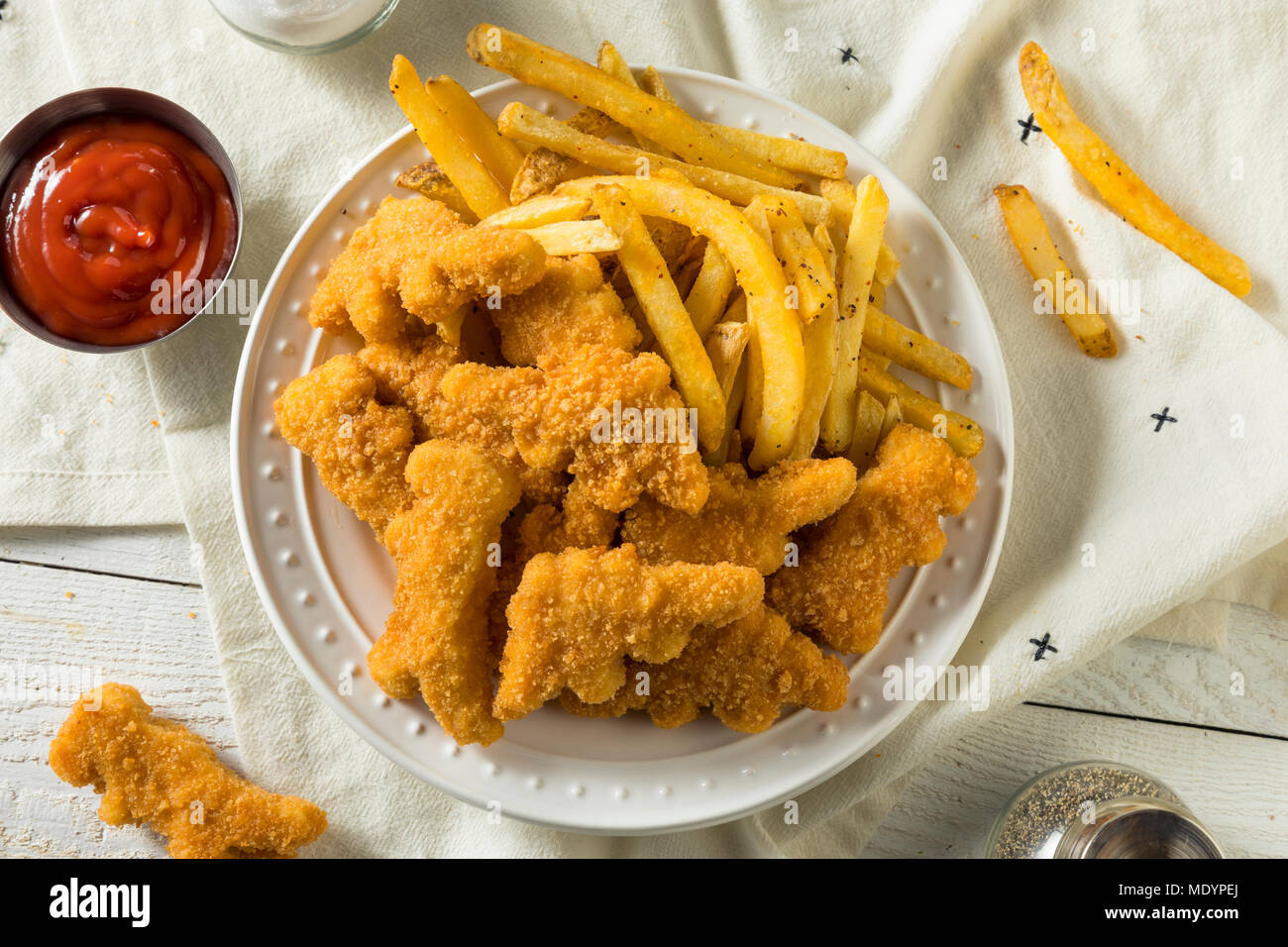 Kids Dinosaur Shaped Chicken Nuggets Ready to Eat Stock Photo