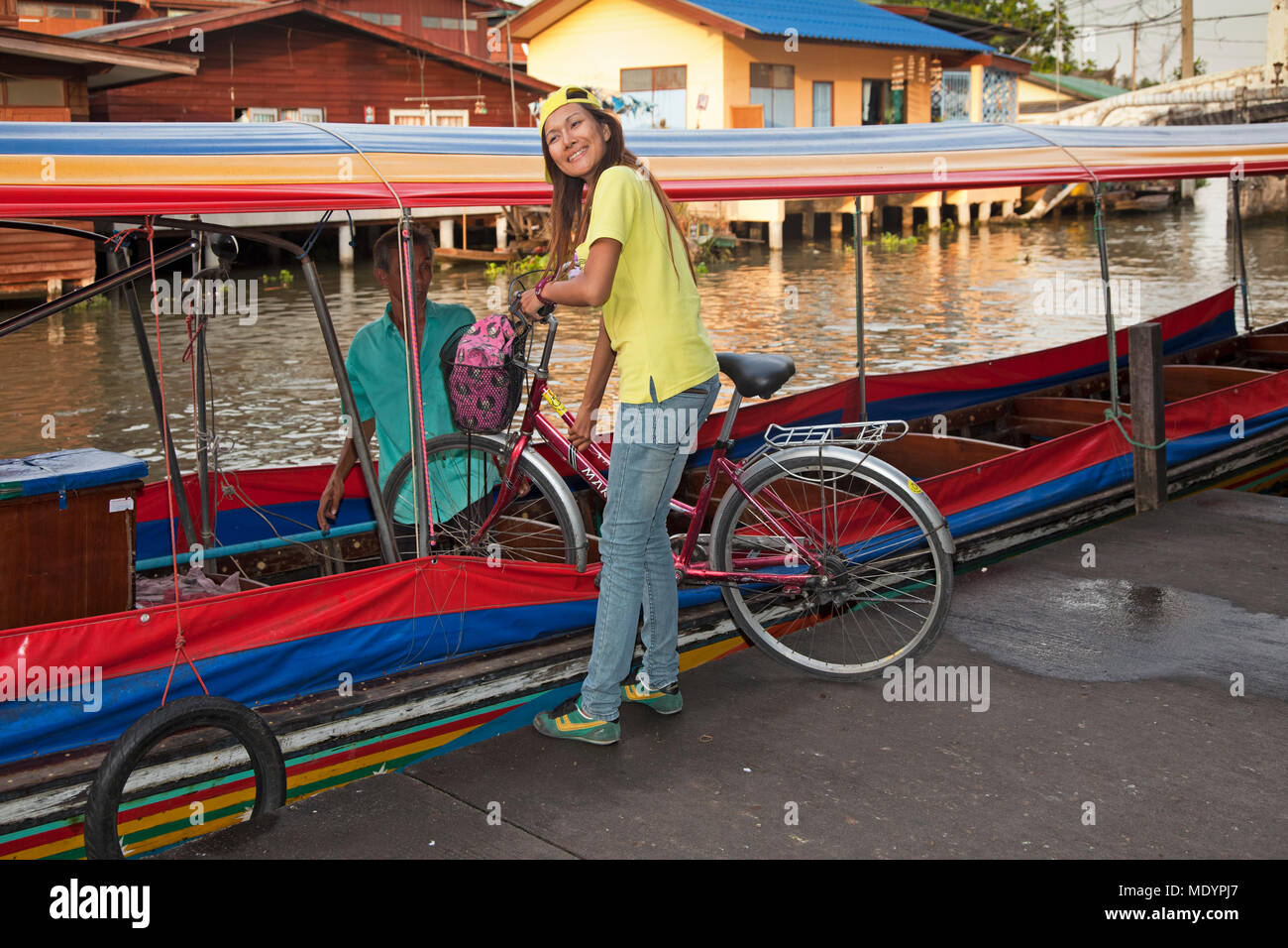 Longtail boat carrying tour bicycles on Chao Phraya river, Bangkok, Thailand Stock Photo