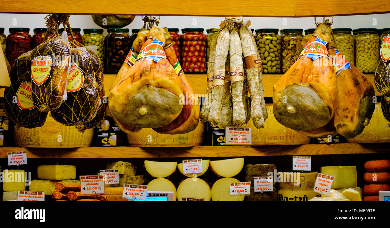 Hams and cheeses in a shop in Bologna Italy Stock Photo Alamy