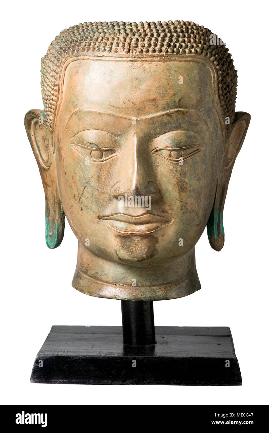 Bronze head of Buddha on stand isolatad on white background. Clipping path. Stock Photo