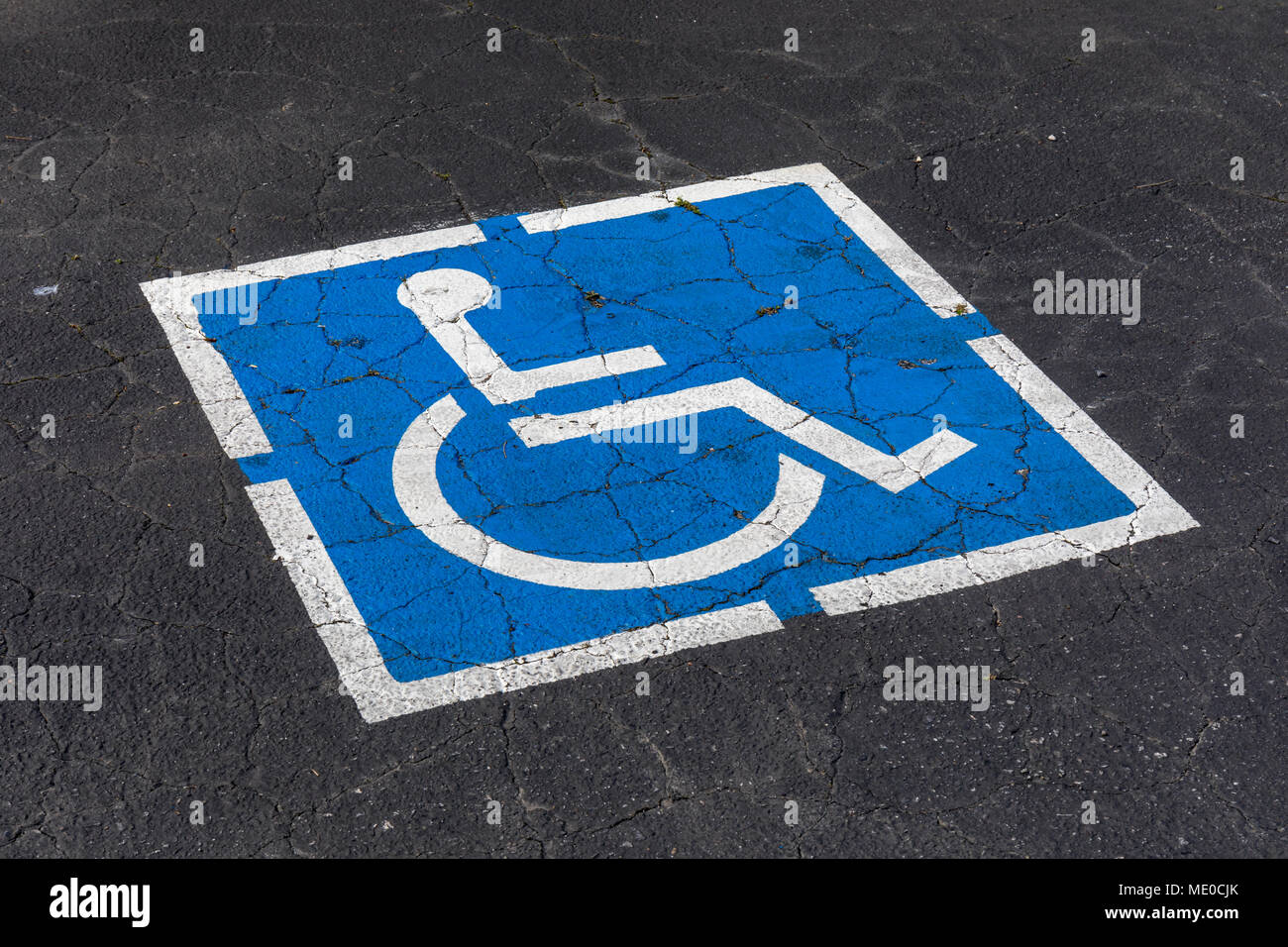 Disabled parking sign on asphalt Stock Photo