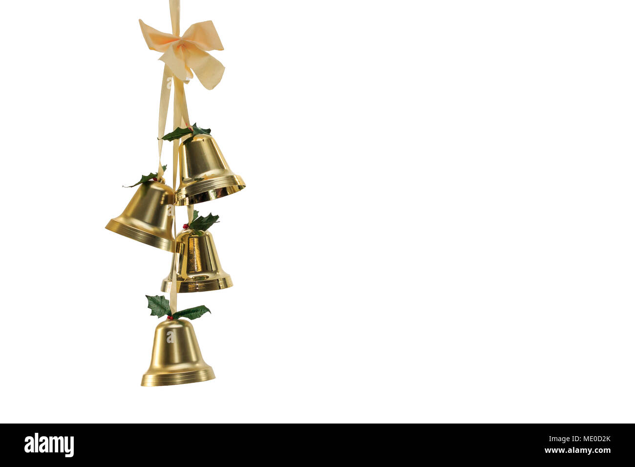 Four Gold Christmas Bells hanging from ribbons with a bow isolated on white background Stock Photo