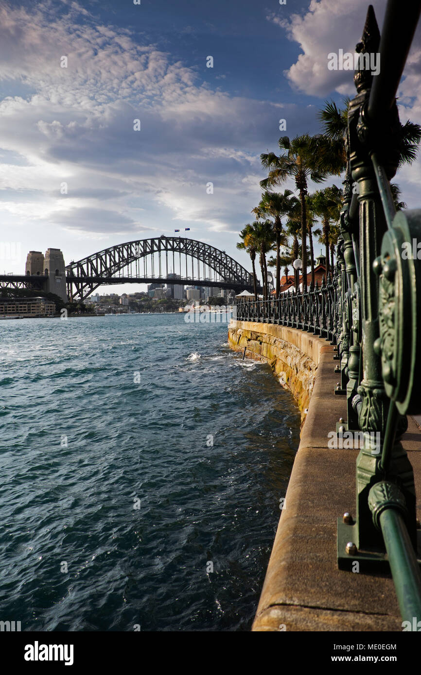Circular Quay promenade at Sydney Cove with the Sydney Harbour Bridge in the background in Sydney, Australia Stock Photo