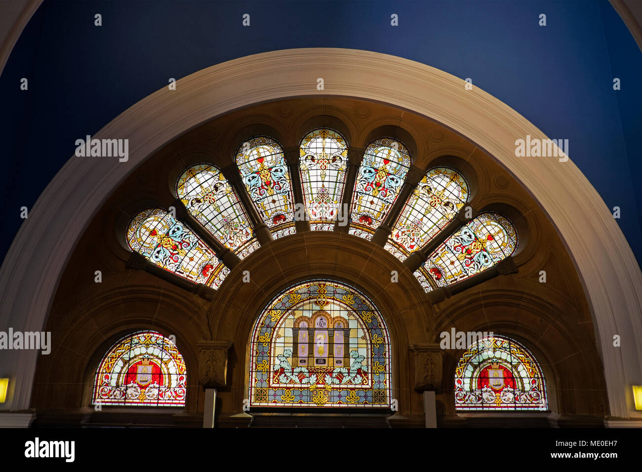 Arch with stained glass windows over the Street entrance of the