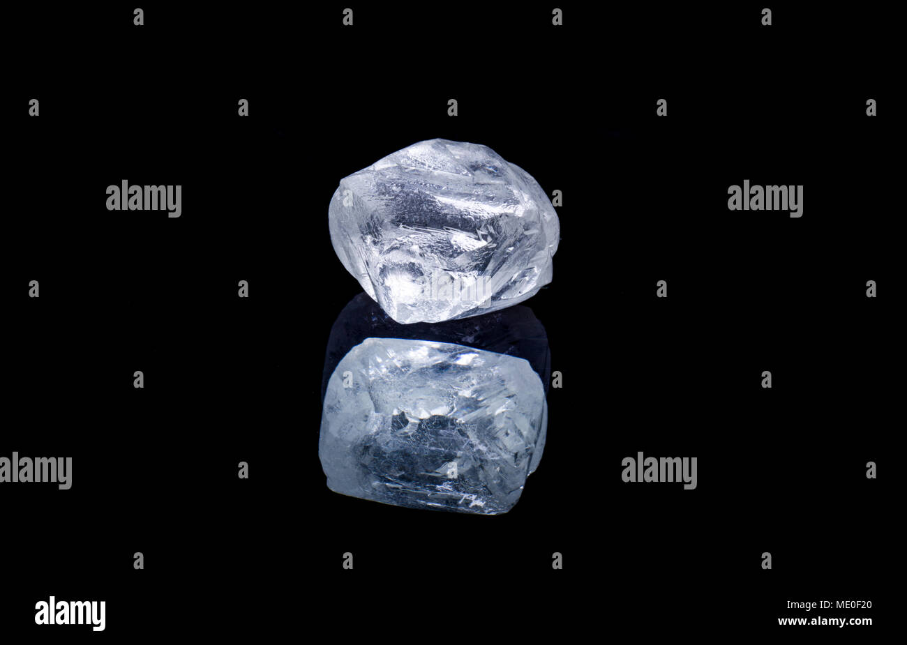 Raw diamond isolated on black background Stock Photo - Alamy