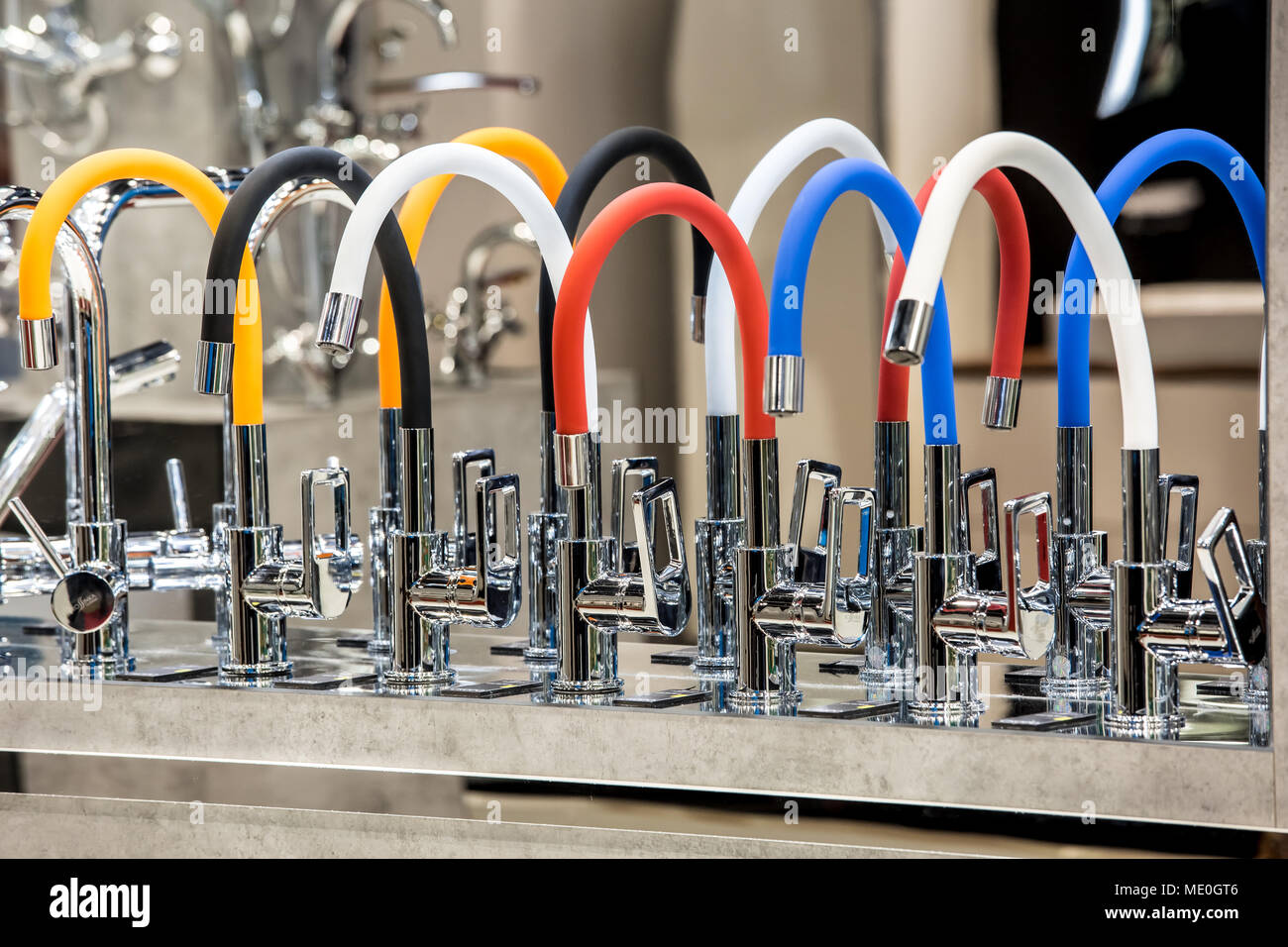 Variety of modern kitchen colourful metal faucets in the shop Stock ...