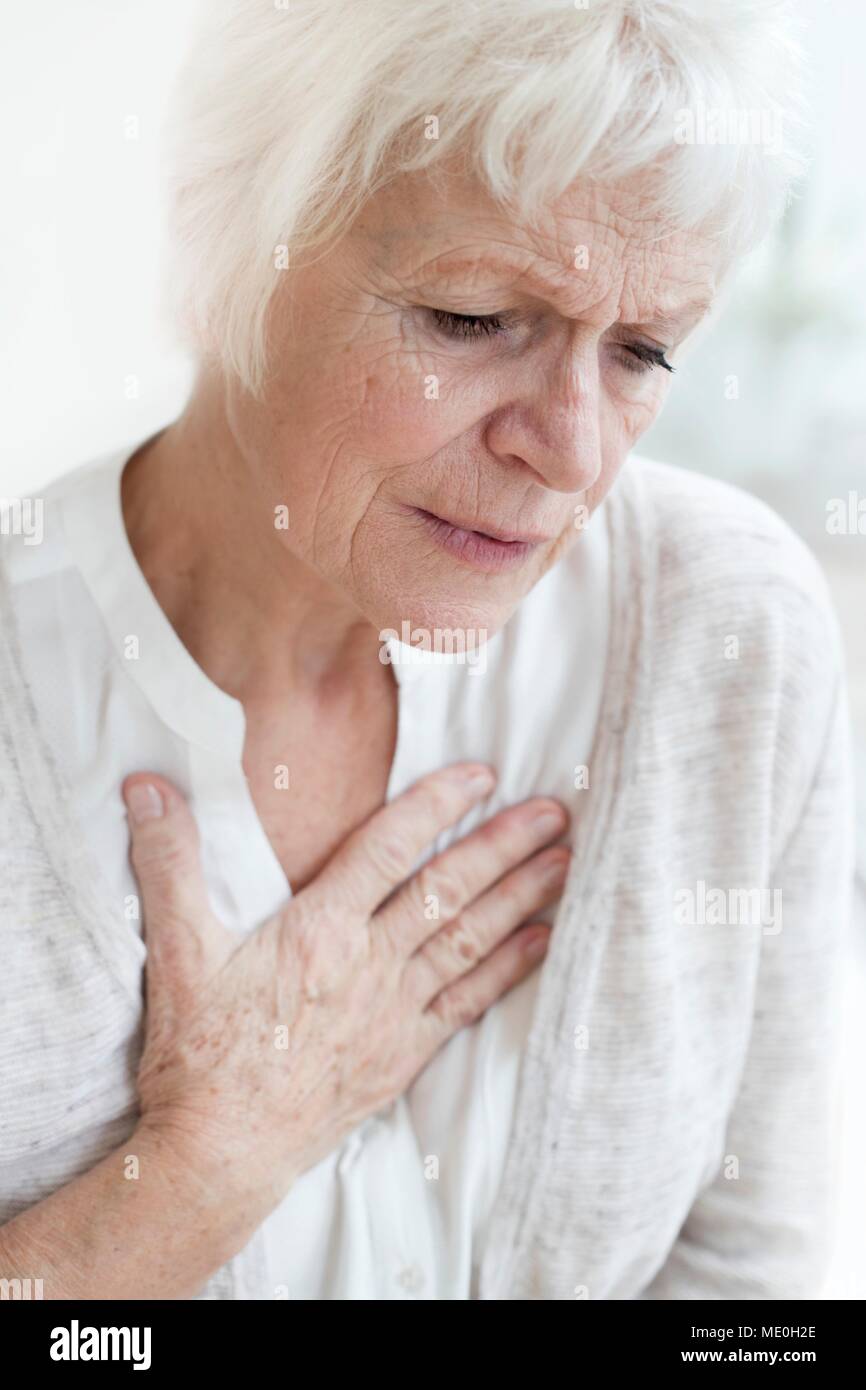 Senior woman touching chest. Stock Photo