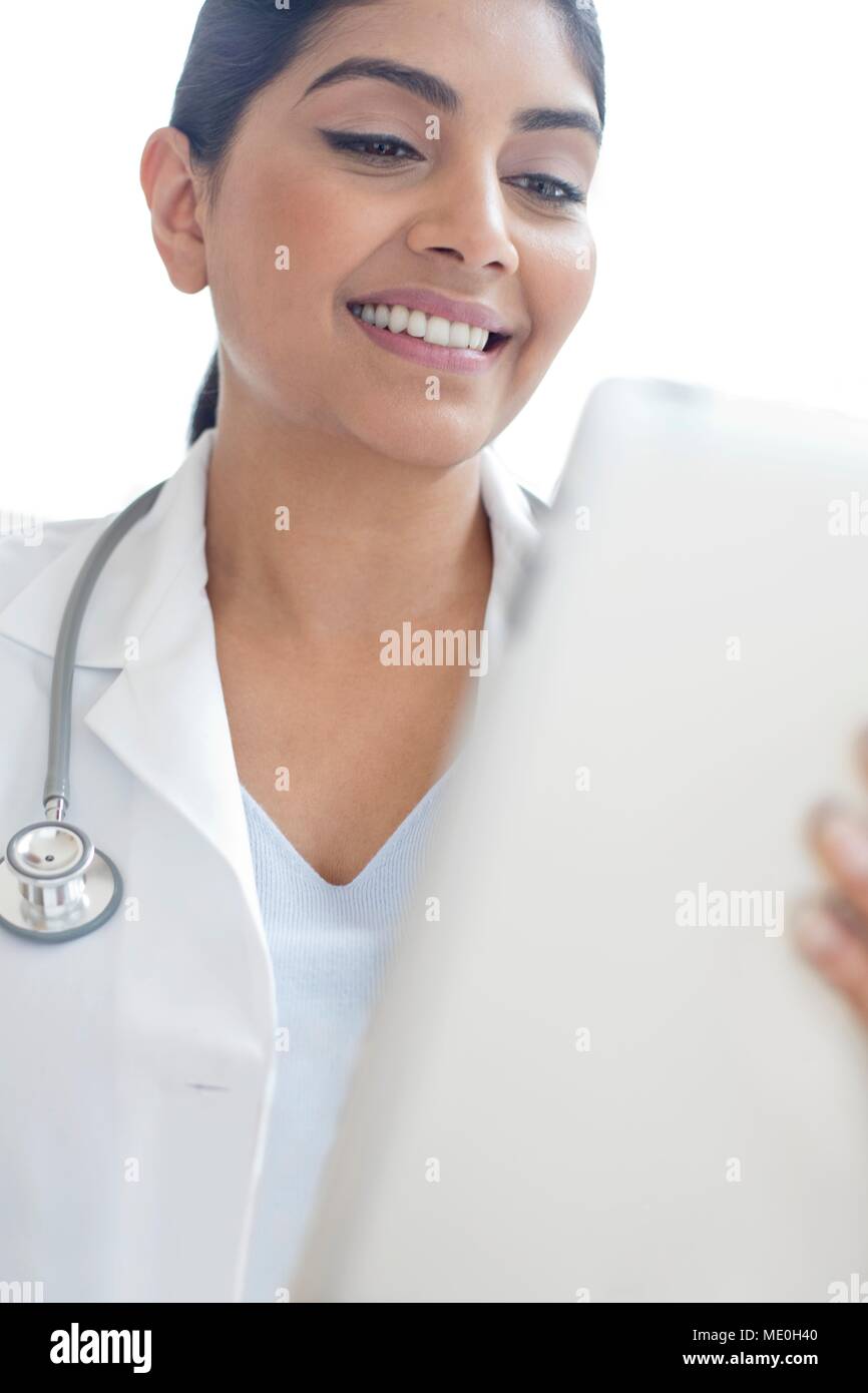 Female doctor using digital tablet. Stock Photo