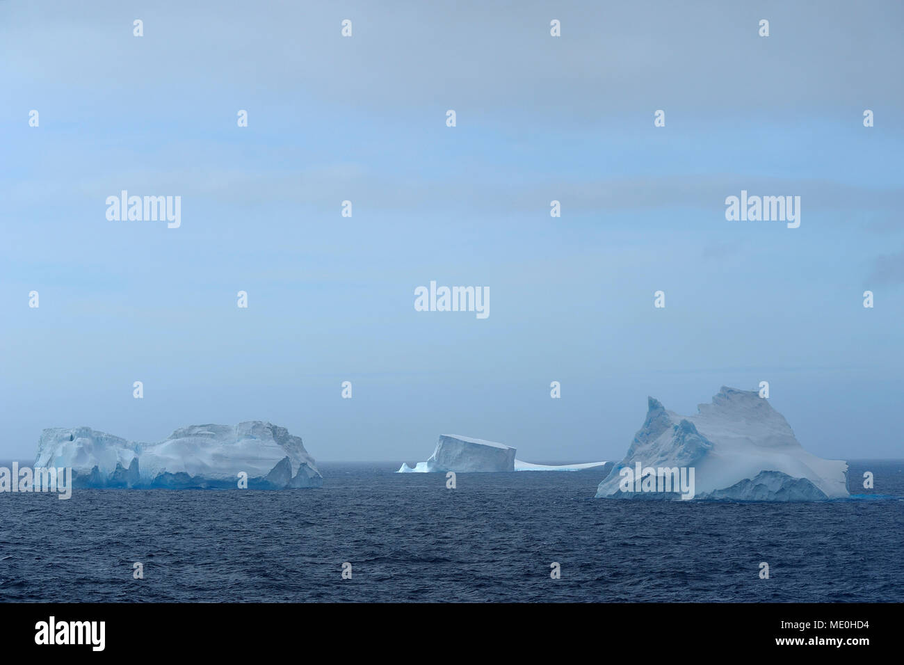 Icebergs floating in the Antarctic Sound on an overcast day at the Antarctic Peninsula, Antarctica Stock Photo