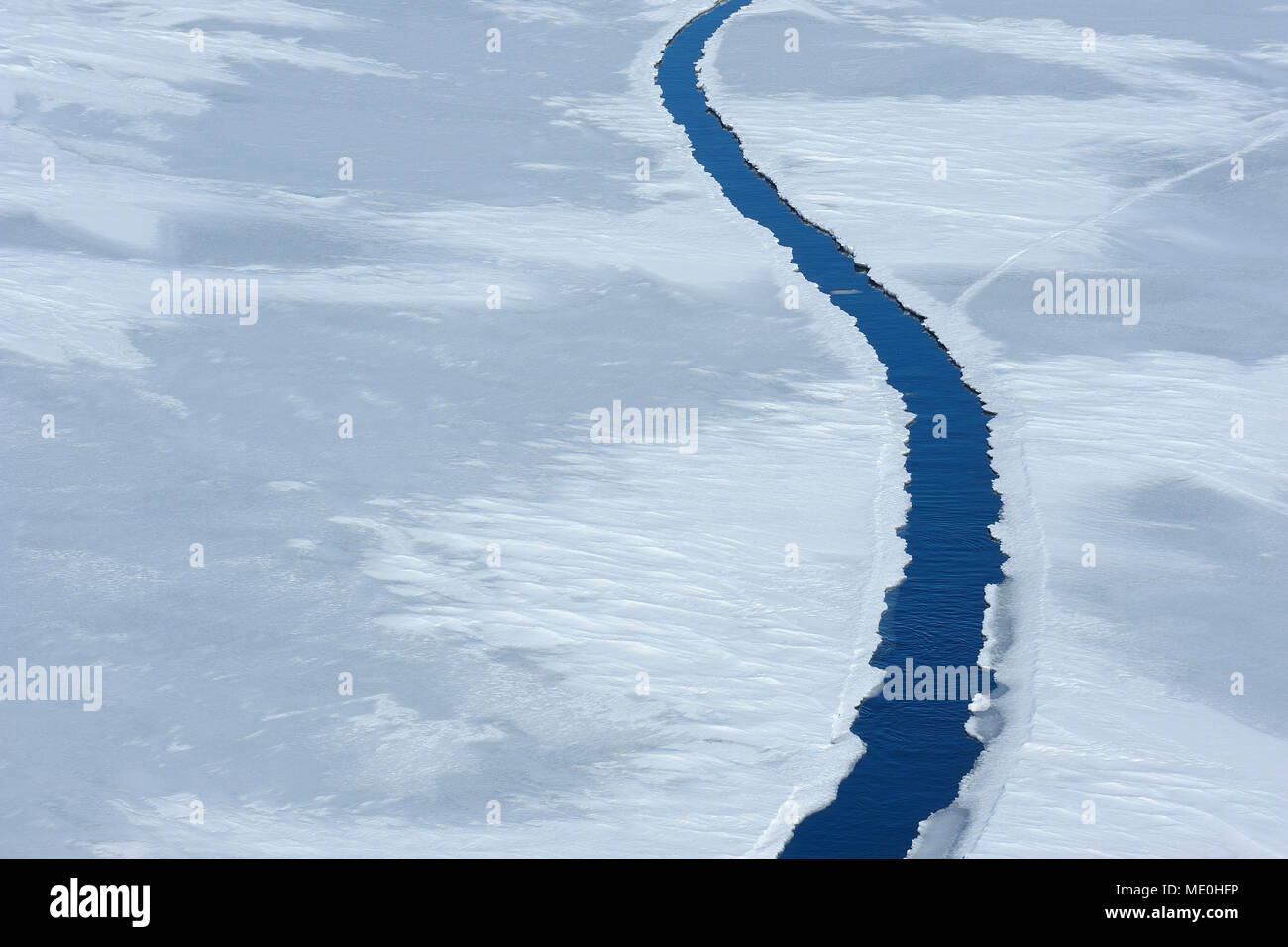 Elevated view of a large crack in pack ice at Snow Hill Island on the Weddel Sea at the Antarctic Peninsula, Antarctica Stock Photo