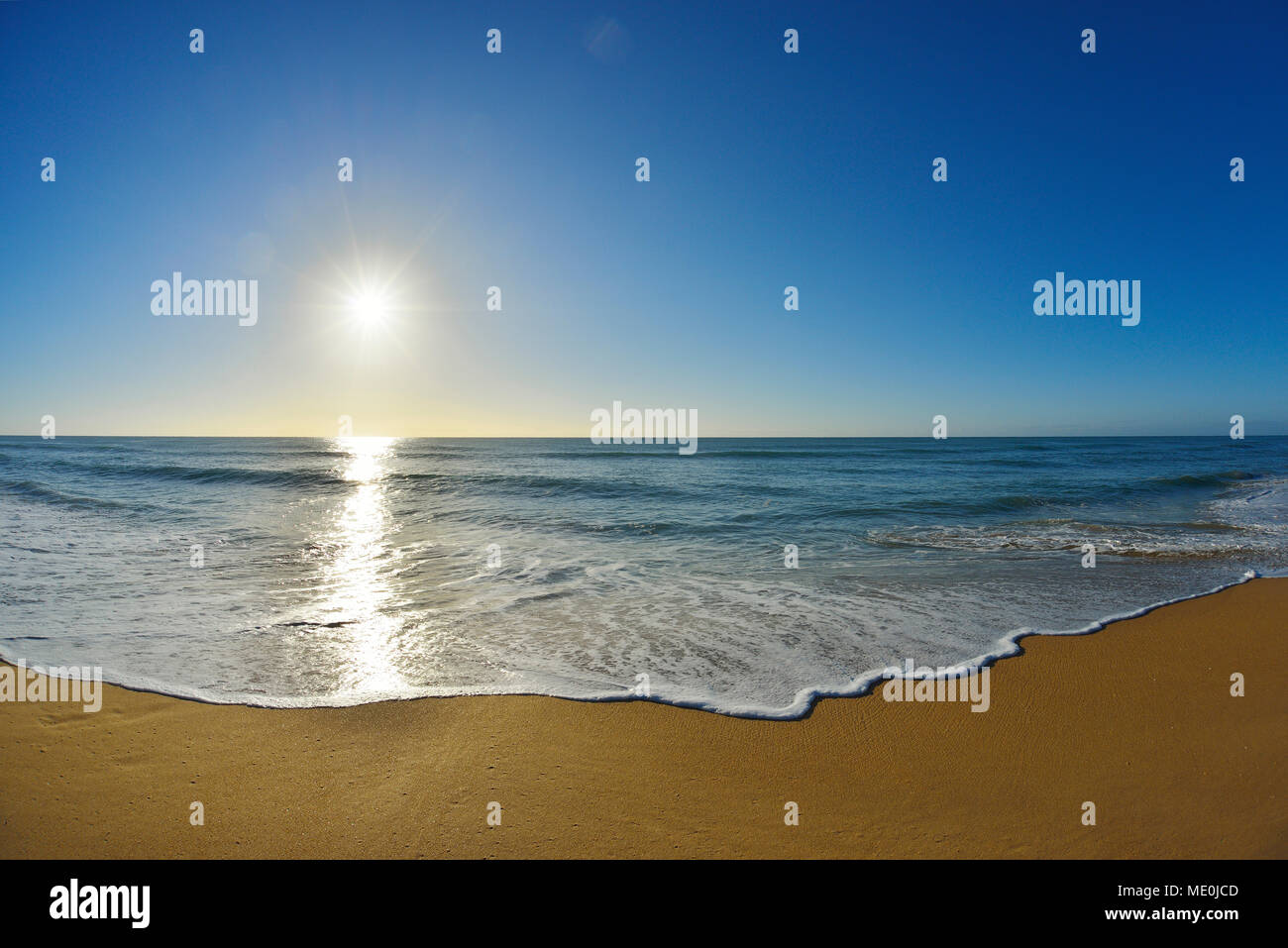 Surf breaking on the shoreline of Mile Beach at Paradise Beach