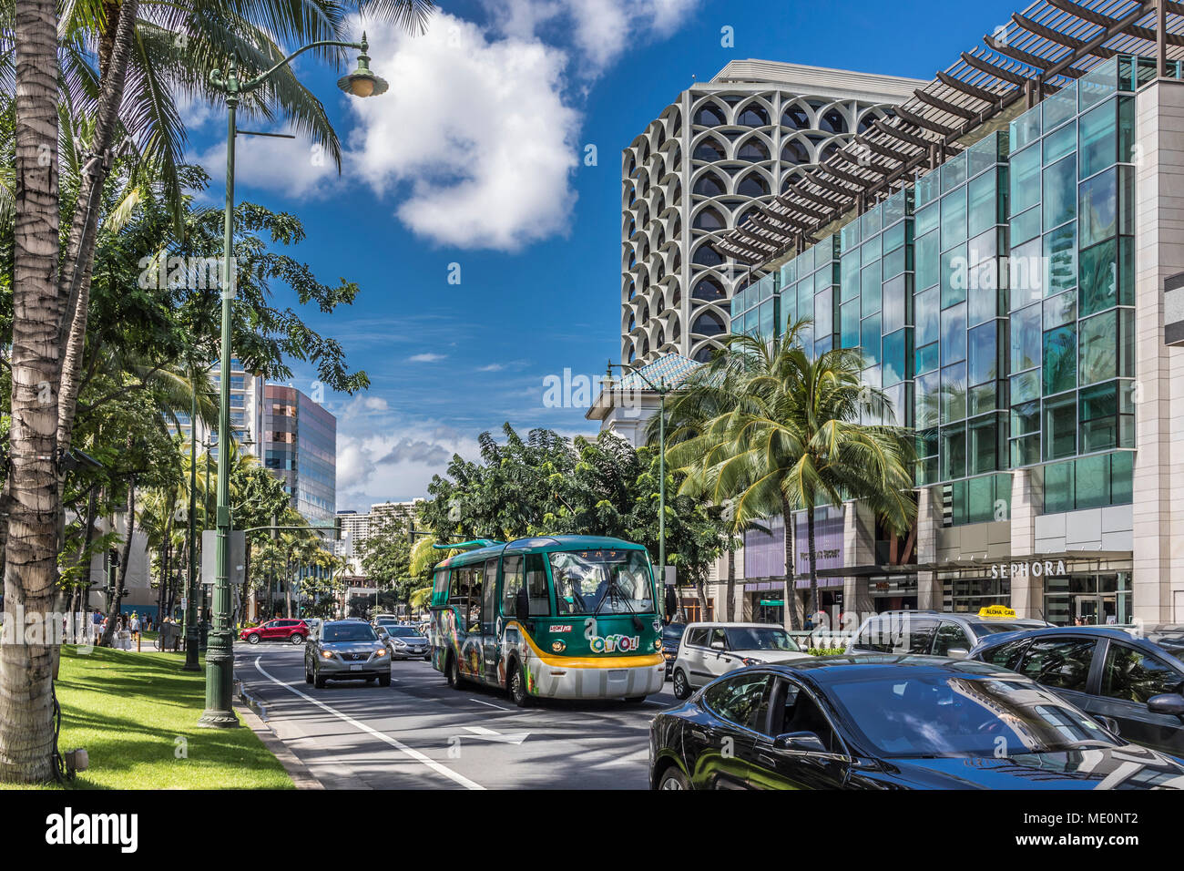 Looking towards the West along Kalakaua Avenue in Waikiki; Honolulu, Oahu, Hawaii, United States of America Stock Photo