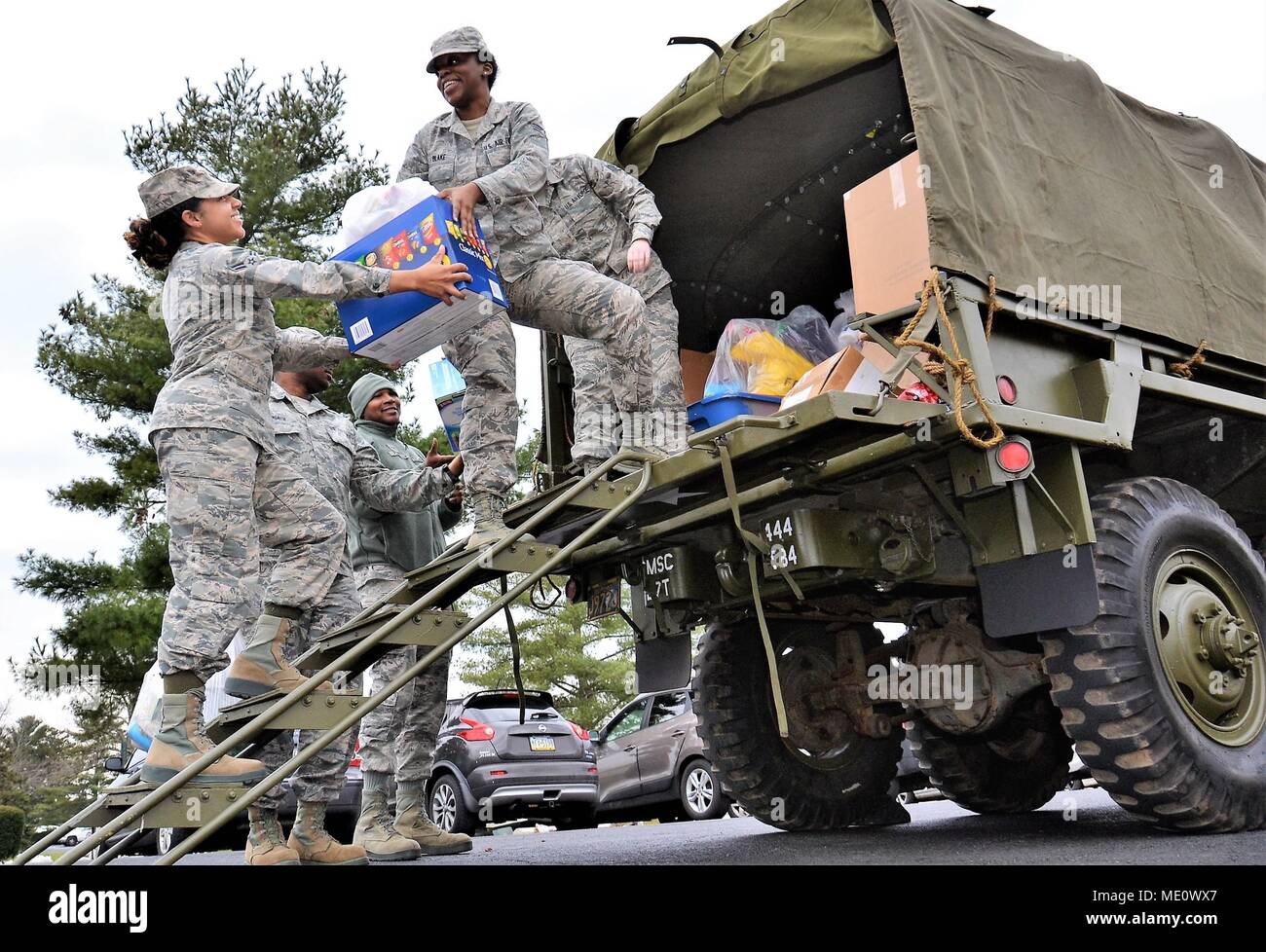 The North Whales Borough Parks and Recreation Military Living History Association, based in Hatboro, Pa., dropped off items donated at the collection campaign held during their historical tour event, A Soldier’s Christmas, to help the families of deployed service members Dec. 12, 2017, at Horsham Air Guard Station, Pa. The donation exhibits the continued support of State military members by local civilian organizations here despite the operational closure of Naval Air Station Joint Reserve Base Willow Grove, Sept. 15, 2011. (U.S. Air National Guard photo by Tech. Sgt. Andria Allmond) Stock Photo