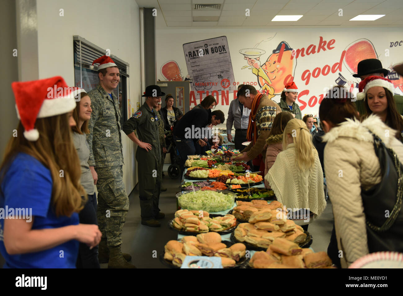 Attendees fill their plates with food during the Duxford Christmas