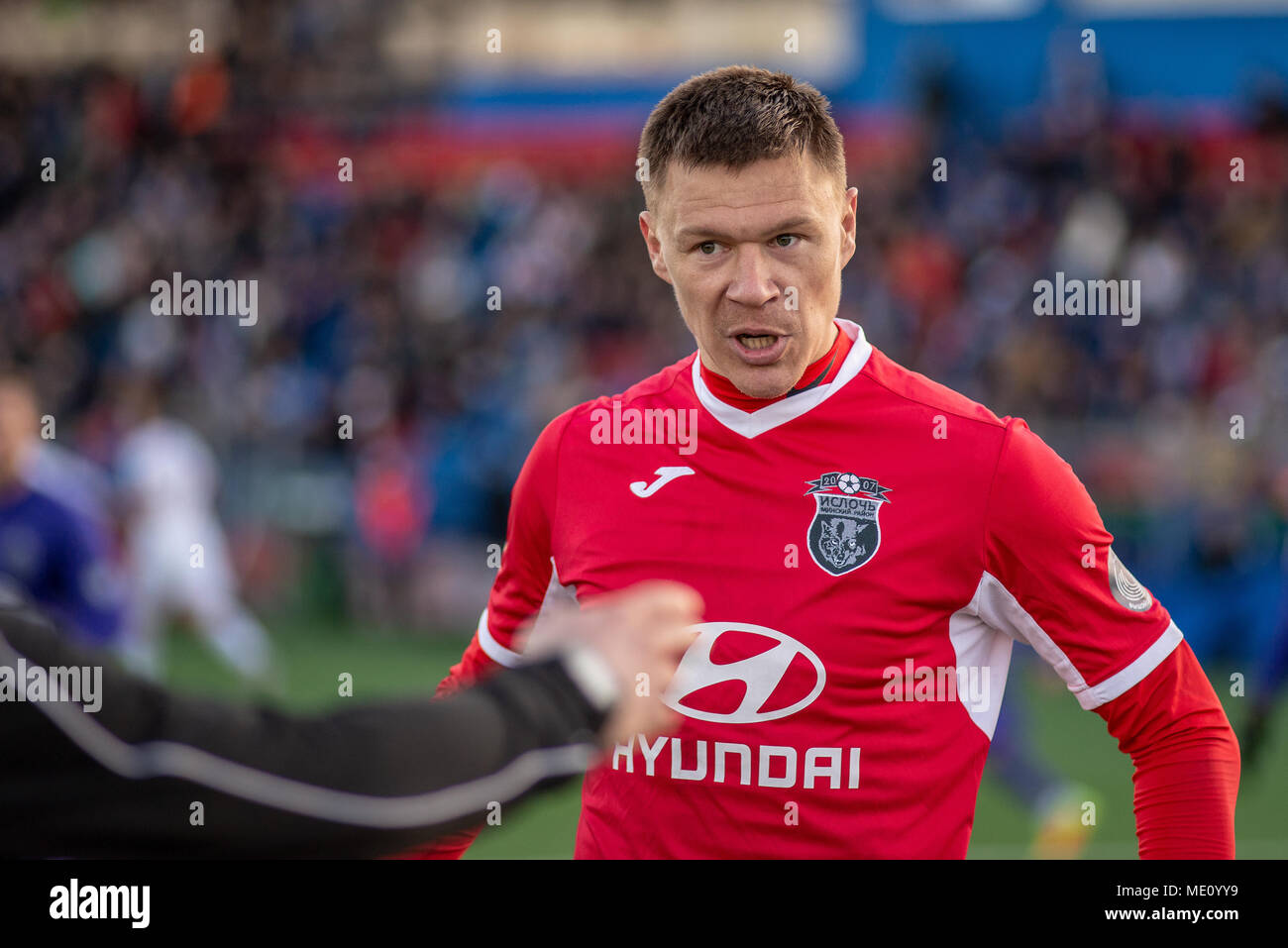 MINSK, BELARUS - APRIL 7, 2018:Sergey Turanok goalkeeper of Isloch screams during the Belarusian Premier League football match between FC Dynamo Minsk and FC Isloch at the FC Minsk Stadium Stock Photo