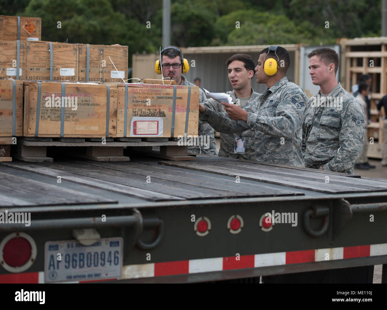 U.S. Air Force Airmen from the 18th Munitions Squadron verify serial