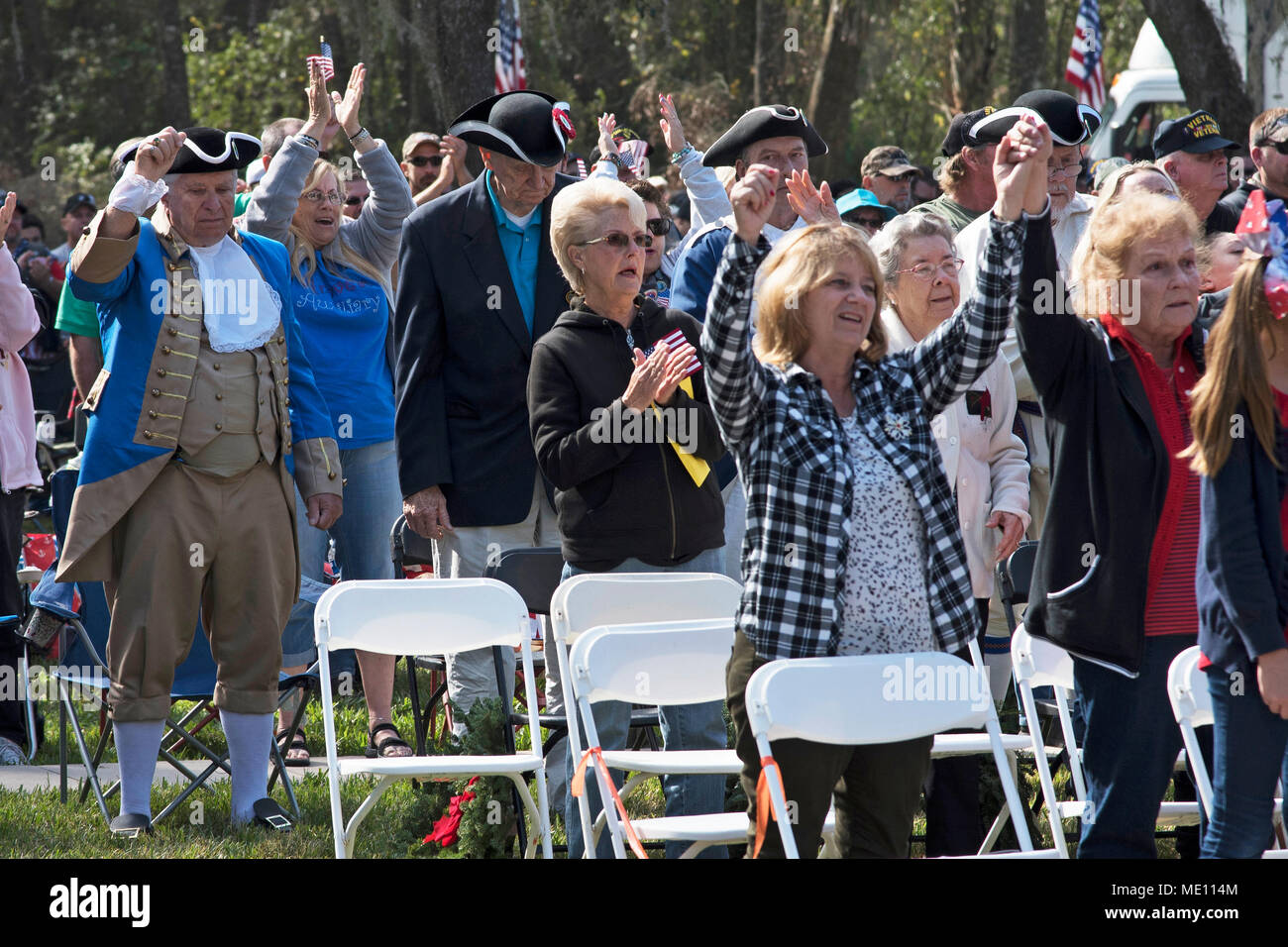 Participants sing and cheer during the Wreaths Across America Wreath