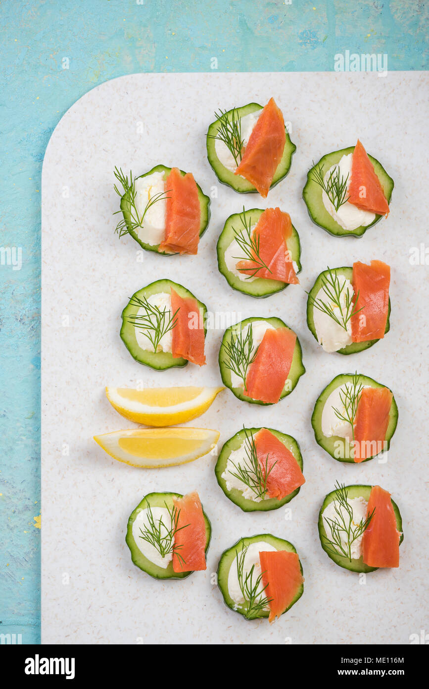 Cucumber canapee with cottage cheese and salmon. Stock Photo