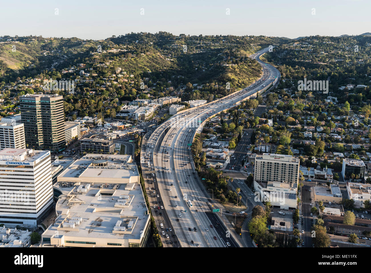 Los Angeles, California, USA - April 18, 2018:  Late afternoon aerial view of 405 Freeway and Sepulveda Pass in the San Fernando Valley. Stock Photo