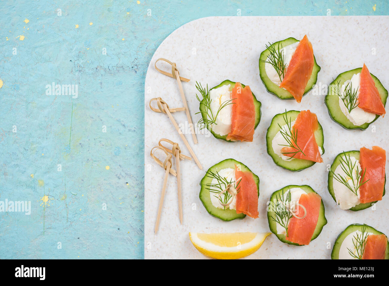 Smoked salmon, cottage cheese and cucumber snack for garden party. Stock Photo