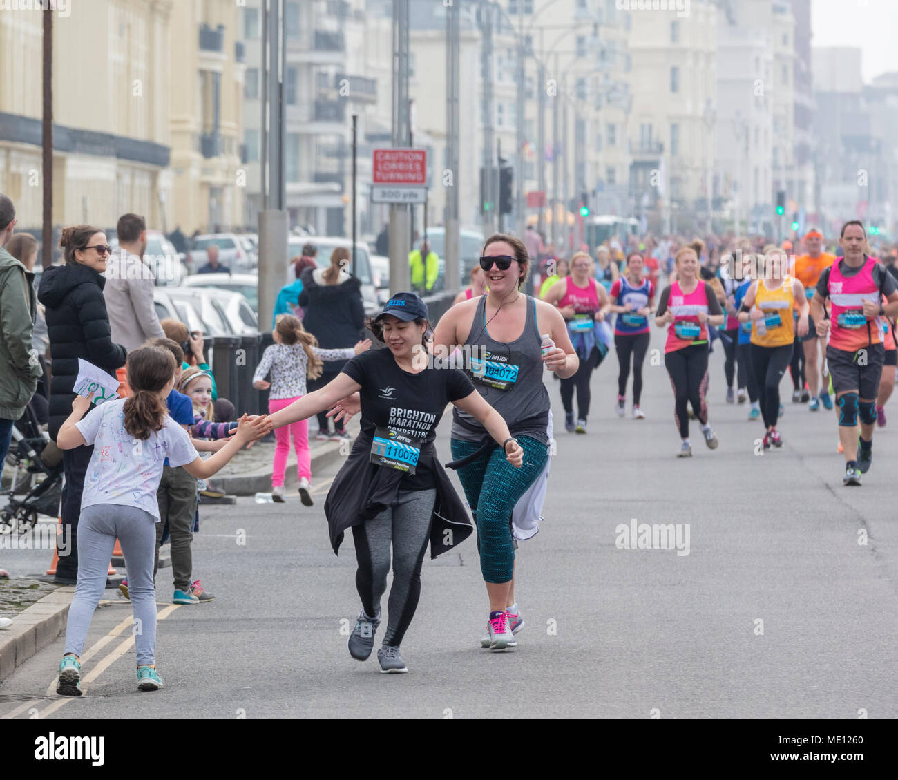 Brighton, Sussex, UK; 15th April 2018; Children Lining the Route 'High Five' Runners in the 10K Event Stock Photo