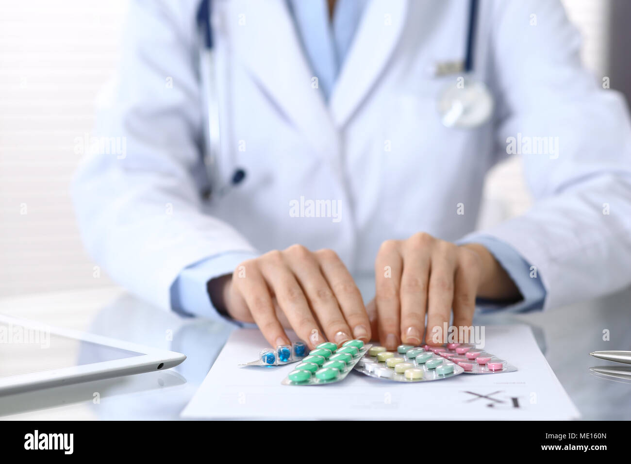 Doctor holding pack of different tablet blisters closeup. Life save