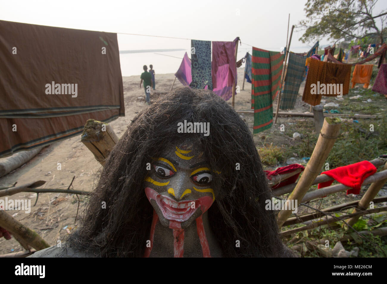 MUNSHIGONJ, BANGLADESH - JANUARY 24 : Hindu devotees keep their goddess in open air after losing their prayer temple causes of Padma river erosion  in Stock Photo