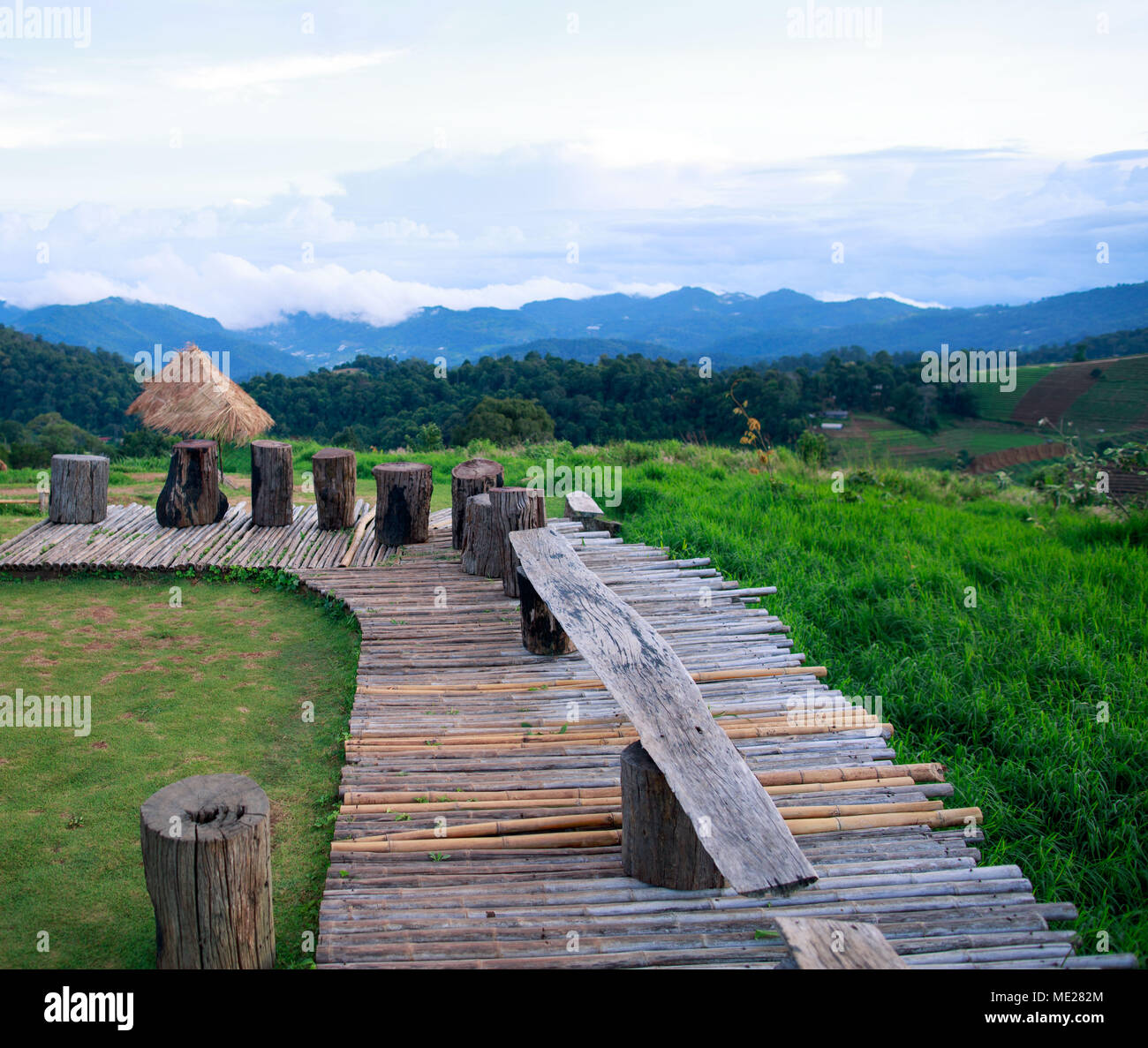 Bamboo walkway on a Thai mountaintop resort before sunset Stock Photo