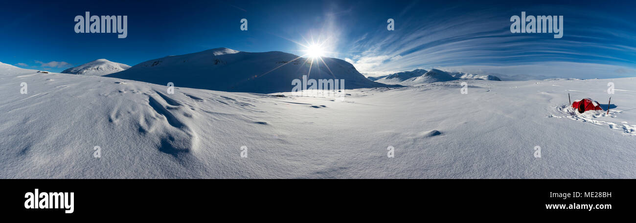 Tent with sun in the snow, Kungsleden or king's trail, Province of Lapland, Sweden, Scandinavia Stock Photo