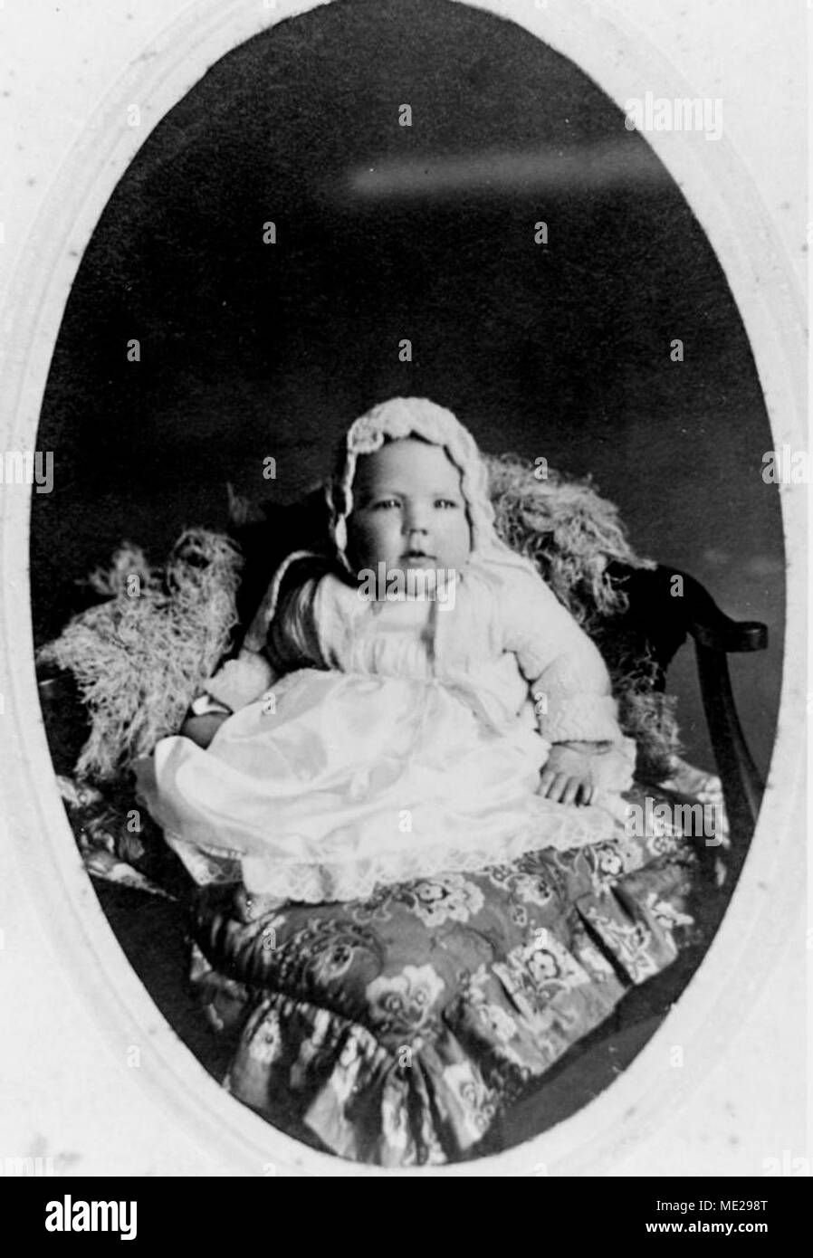 Studio portrait of a baby on a cushion, 1910-1920 Stock Photo - Alamy