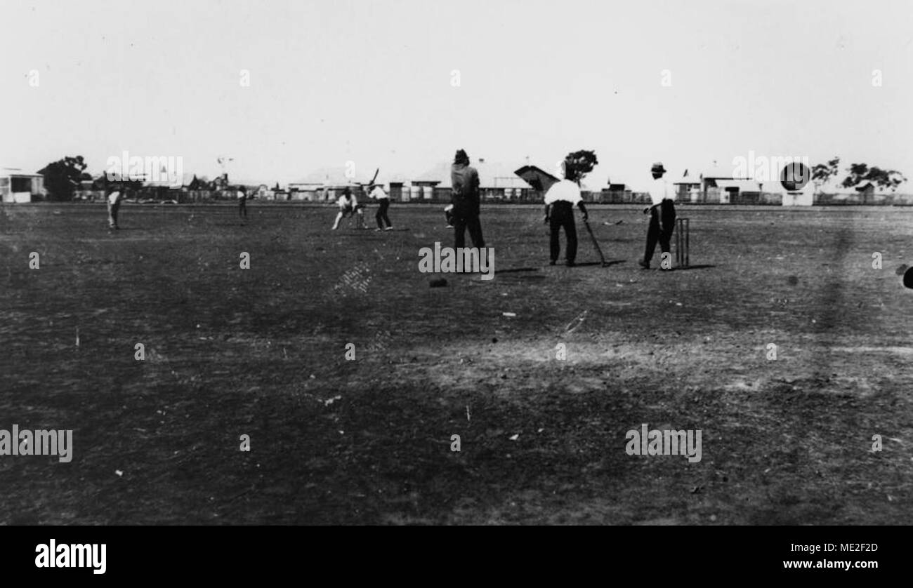 Playing cricket behind Normanton State School, ca 1925. Stock Photo