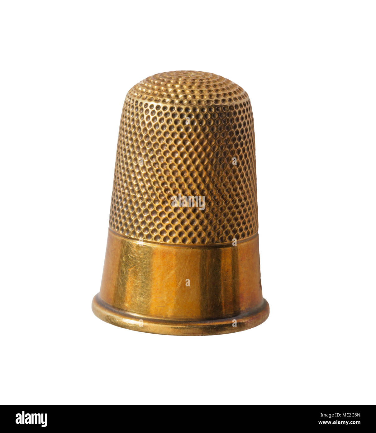 close up of brass thimble isolated on white background Stock Photo