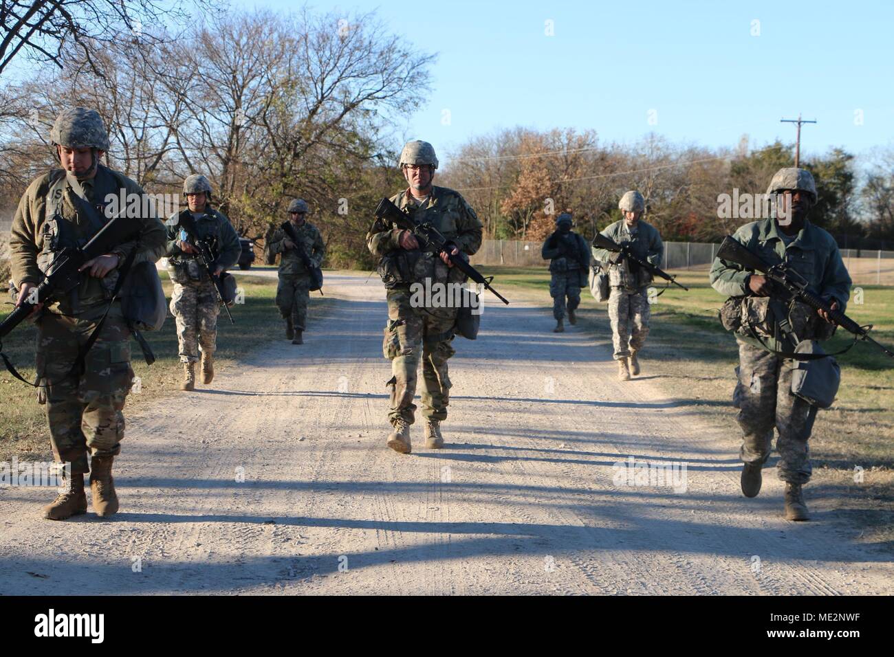 U.S. Army Reserve Soldiers from the 300th Special Troops Battalion, 300th Sustainment Brigade, 4th Sustainment Command (Expeditionary), road march to their next training station during a Deployment Readiness Exercise at the Seagoville, TX, Armed Forces Reserve Center Dec. 9, 2017. Deployment Readiness Exercises are used to gauge Soldier readiness, identify unit strengths and weaknesses, and to prepare Soldiers for short notice deployments. (U.S. Army Reserve photo by Capt. Jose L. Caballero Jr.) Stock Photo