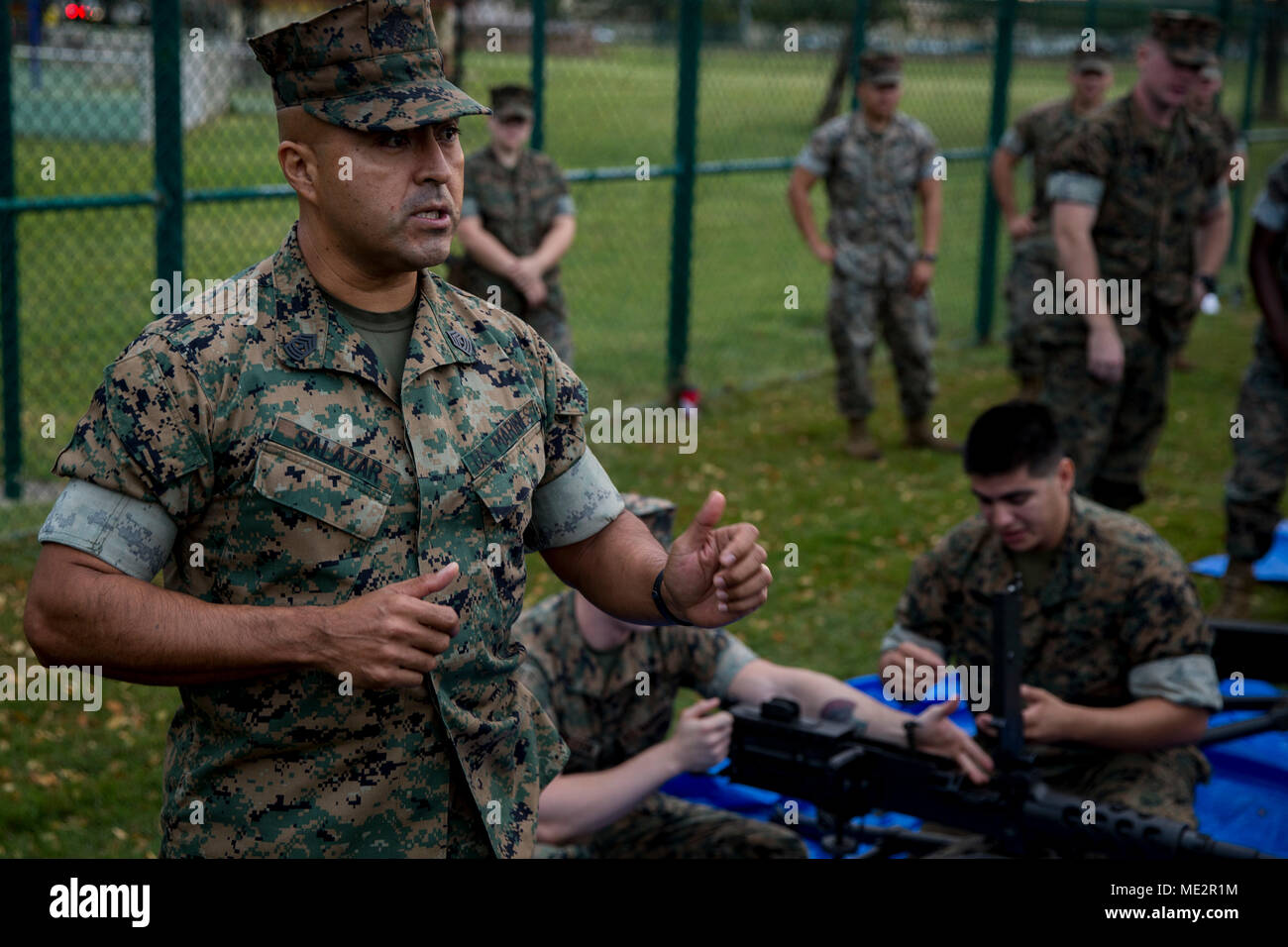 U.S. Marine Corps 1st Sgt. Alvaro Salazar, first sergeant, Service Company, Headquarters Battalion, Marine Corps Base Hawaii, speaks during a professional military education (PME) event, Dec. 8, 2017. The PME focused on crew-served weapons, radio operating procedures, and medical care techniques to sustain military skills and produce readiness. (U.S. Marine Corps Photo by Sgt. Alex Kouns) Stock Photo