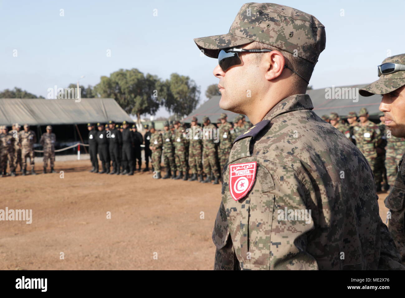 a-tunisian-soldier-stands-in-formation-during-the-opening-ceremony-of-exercise-african-lion-18-april-16-2018-tifnit-morocco-units-from-the-us-marine-corps-us-army-great-britain-and-tunisia-will-conduct-a-multi-lateral-field-training-exercise-with-units-from-the-royal-moroccan-armed-forces-focusing-on-counter-violent-extremist-organization-operations-special-focus-of-effort-will-be-placed-on-offensive-combat-operations-including-close-quarters-battle-training-limited-scale-demolitionsbreaching-operations-and-raid-operations-us-marine-corps-photo-by-1st-lt-brett-lazaroff-ME2X76.jpg