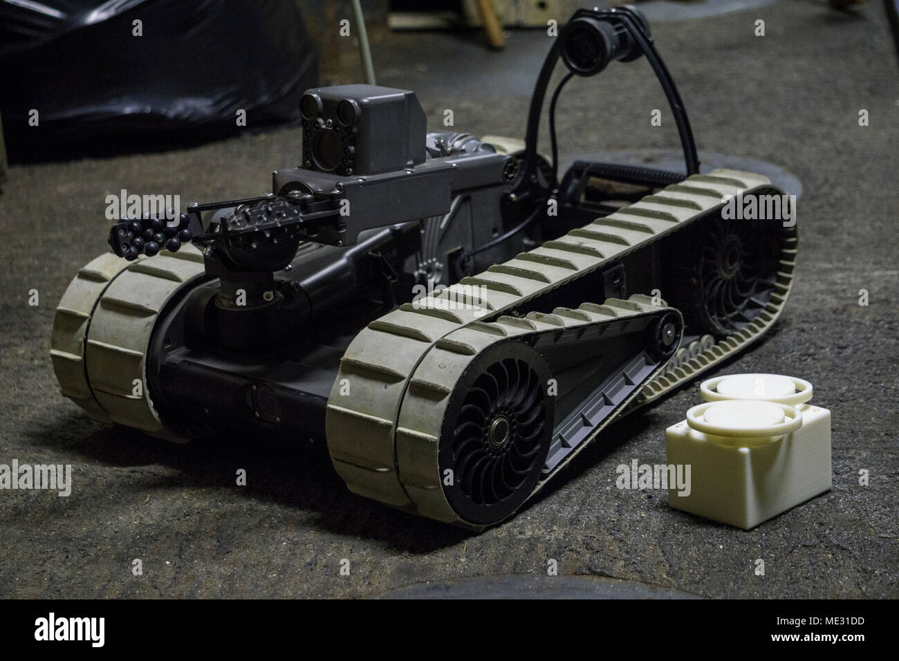 An iRobot 310 Small Unmanned Ground Vehicle belonging to Combat Logistic Battalion 31, 31st Marine Expeditionary Unit, sits staged with 3-D printed lens covers aboard the USS Wasp (LHD-1) while underway in the Pacific Ocean, April 17, 2018. Marines with CLB-31 are now capable of ‘additive manufacturing,’ also known as 3-D printing, which is the technique of replicating digital 3-D models as tangible objects.  The 31st Marine Expeditionary Unit partners with the Navy’s Amphibious Squadron 11 to form the Wasp Amphibious Ready Group, a cohesive blue-green team capable of accomplishing a variety o Stock Photo