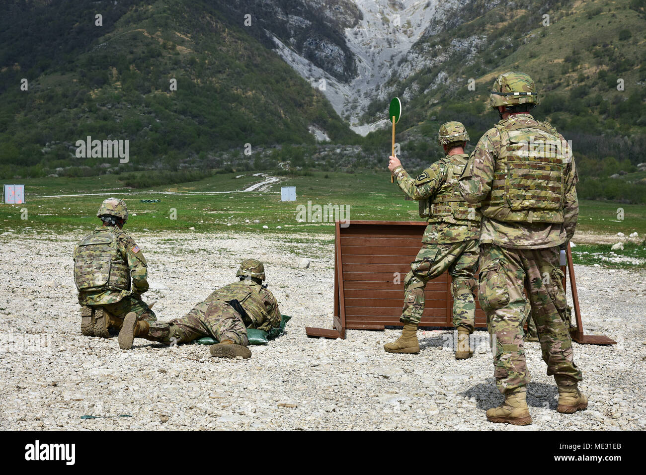U.S. Army Paratrooper assigned to the Battalion Support Brigade, 173rd Airborne Brigade engages a targets with M320 grenade launcher module during weapons qualification at Cao Malnisio Range, Pordenone, Italy, April 17, 2018. The 173rd Airborne Brigade is the U.S. Army Contingency Response Force in Europe, capable of projecting ready forces anywhere in the U.S. European, Africa or Central Commands' areas of responsibility. (U.S. Army Photos by Paolo Bovo) Stock Photo