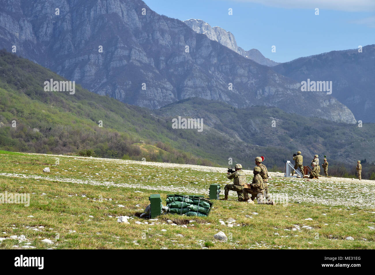 U.S. Army Paratroopers assigned to the Battalion Support Brigade, 173rd Airborne Brigade engage a targets with M320 grenade launcher module during weapons qualification at Cao Malnisio Range, Pordenone, Italy, April 17, 2018. The 173rd Airborne Brigade is the U.S. Army Contingency Response Force in Europe, capable of projecting ready forces anywhere in the U.S. European, Africa or Central Commands' areas of responsibility. (U.S. Army Photos by Paolo Bovo) Stock Photo