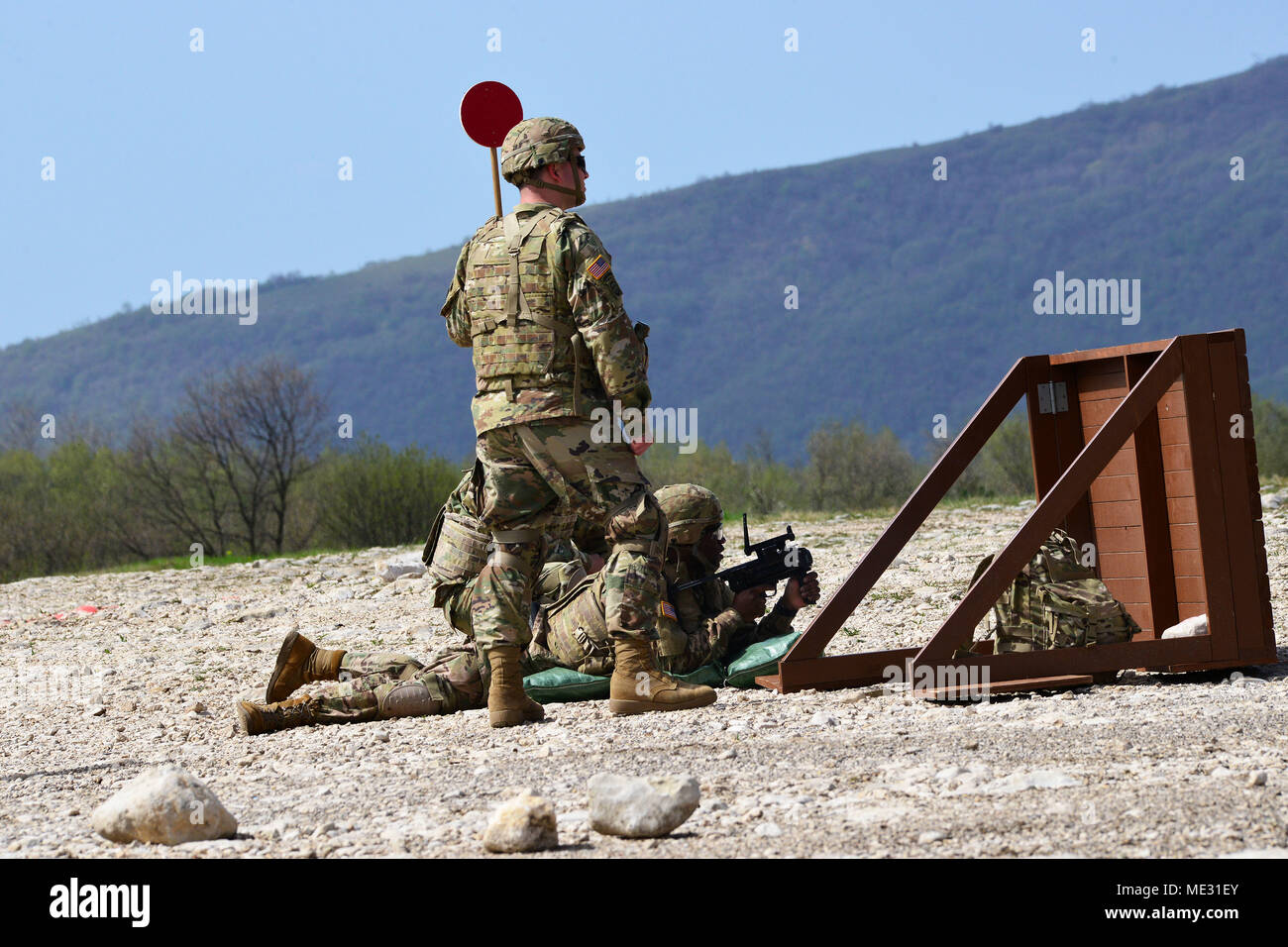 U.S. Army Paratrooper assigned to the Battalion Support Brigade, 173rd Airborne Brigade engages a targets with M320 grenade launcher module during weapons qualification at Cao Malnisio Range, Pordenone, Italy, April 17, 2018. The 173rd Airborne Brigade is the U.S. Army Contingency Response Force in Europe, capable of projecting ready forces anywhere in the U.S. European, Africa or Central Commands' areas of responsibility. (U.S. Army Photos by Paolo Bovo) Stock Photo