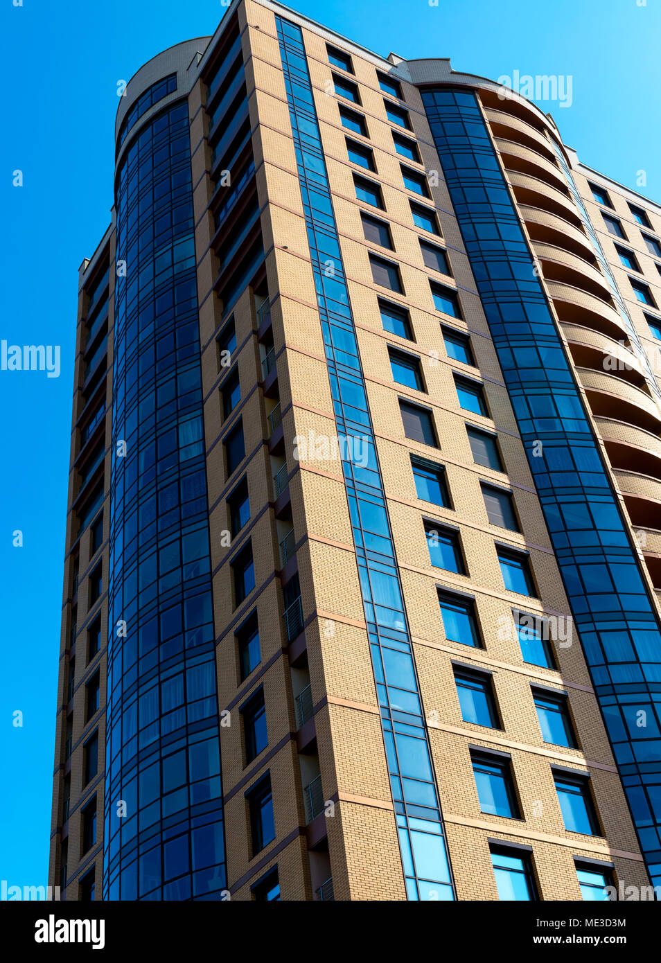 A modern building mirror facade in blue tone Stock Photo - Alamy