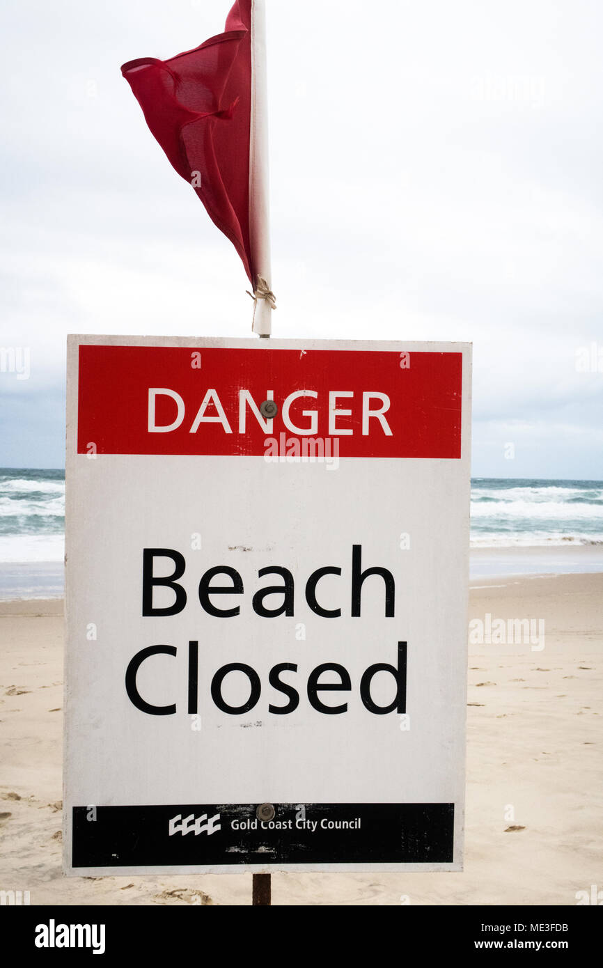 Signs warning of beach closure due to dangerous surf on the Gold Coast in Australia Stock Photo