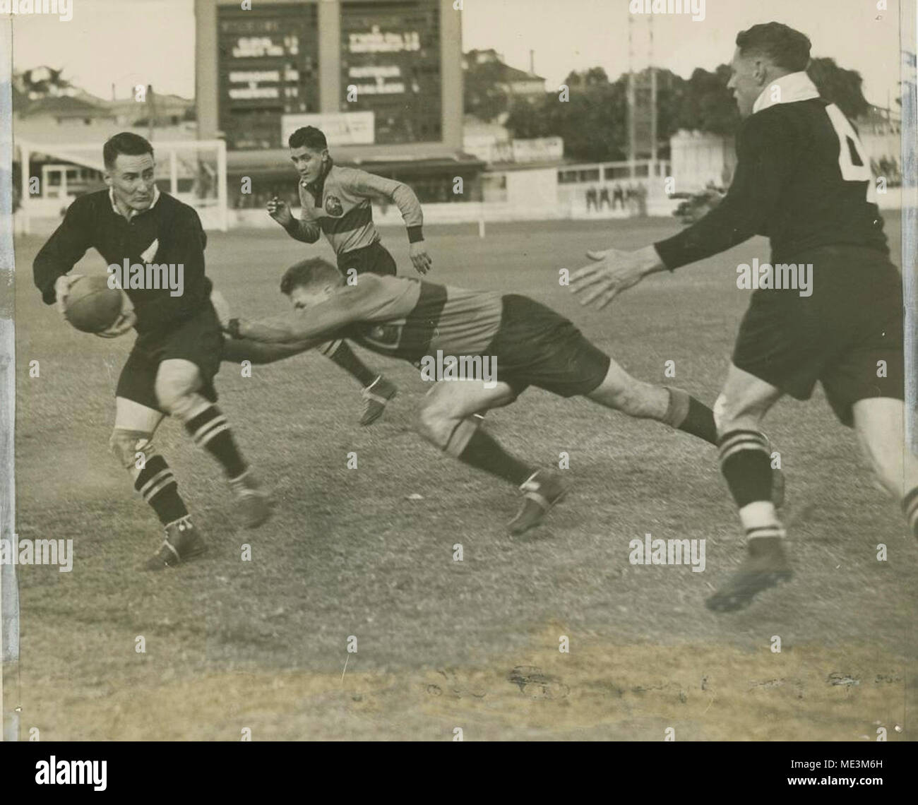 Making a tackle in a game of Rugby, Brisbane Stock Photo Alamy