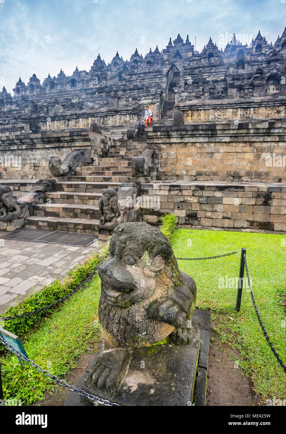 lion statues guard the ascend of the 9th century Borobudur Buddhist temple, Borobudur Archeological Park, Central Java, Indonesia Stock Photo