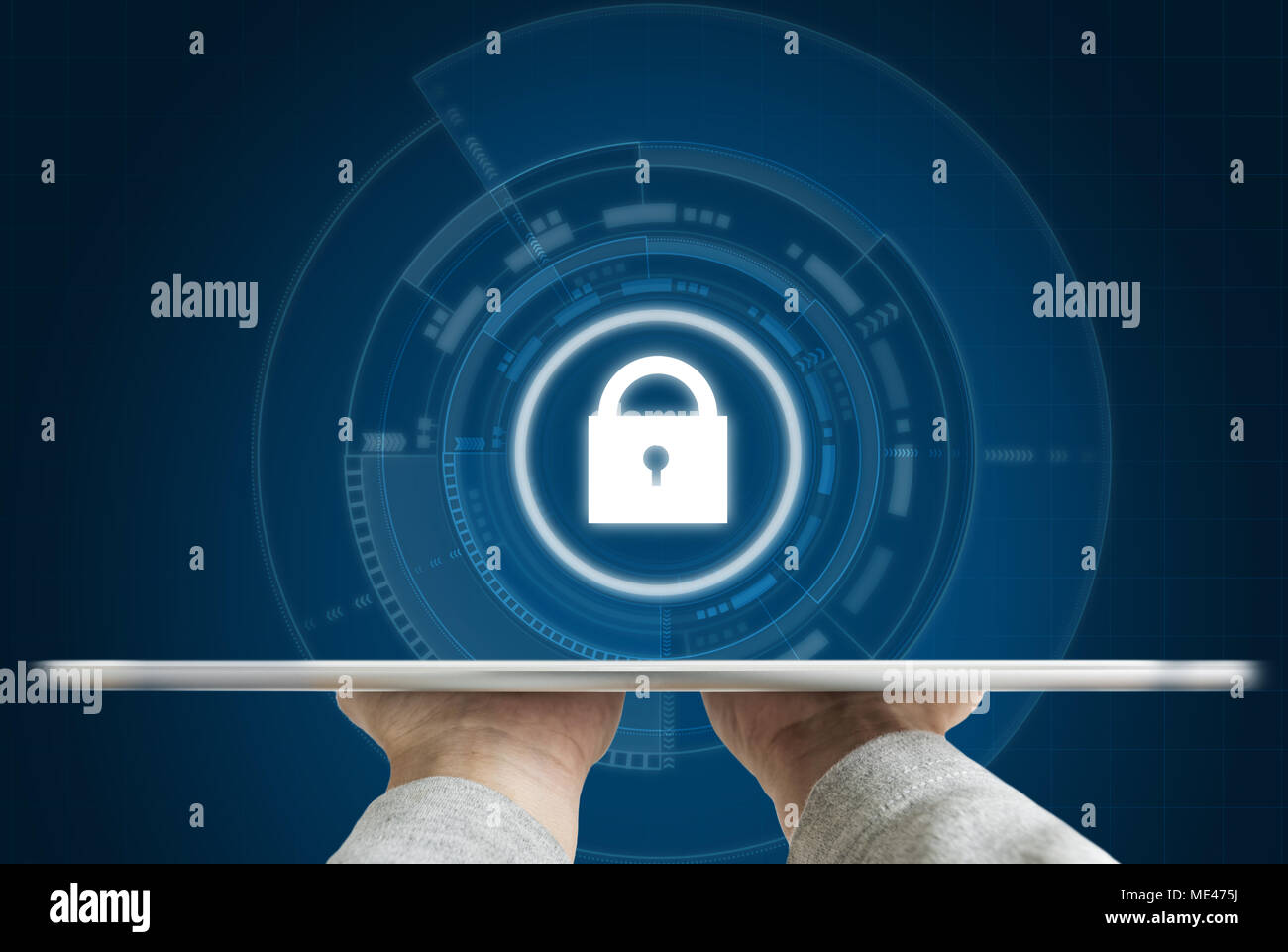 Cyber internet security system. Hand holding digital tablet and security lock technology icon Stock Photo