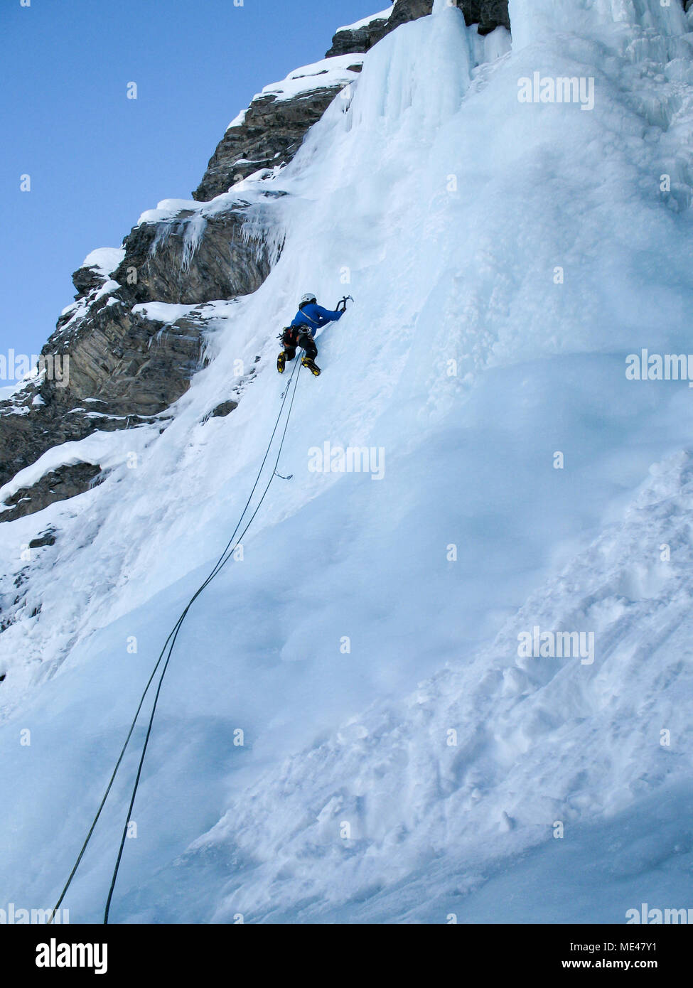 Man climbing ice fall hi-res stock photography and images - Alamy