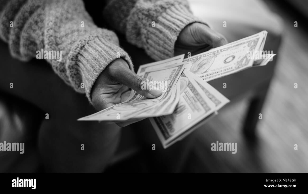 Closeup of woman counting money Stock Photo