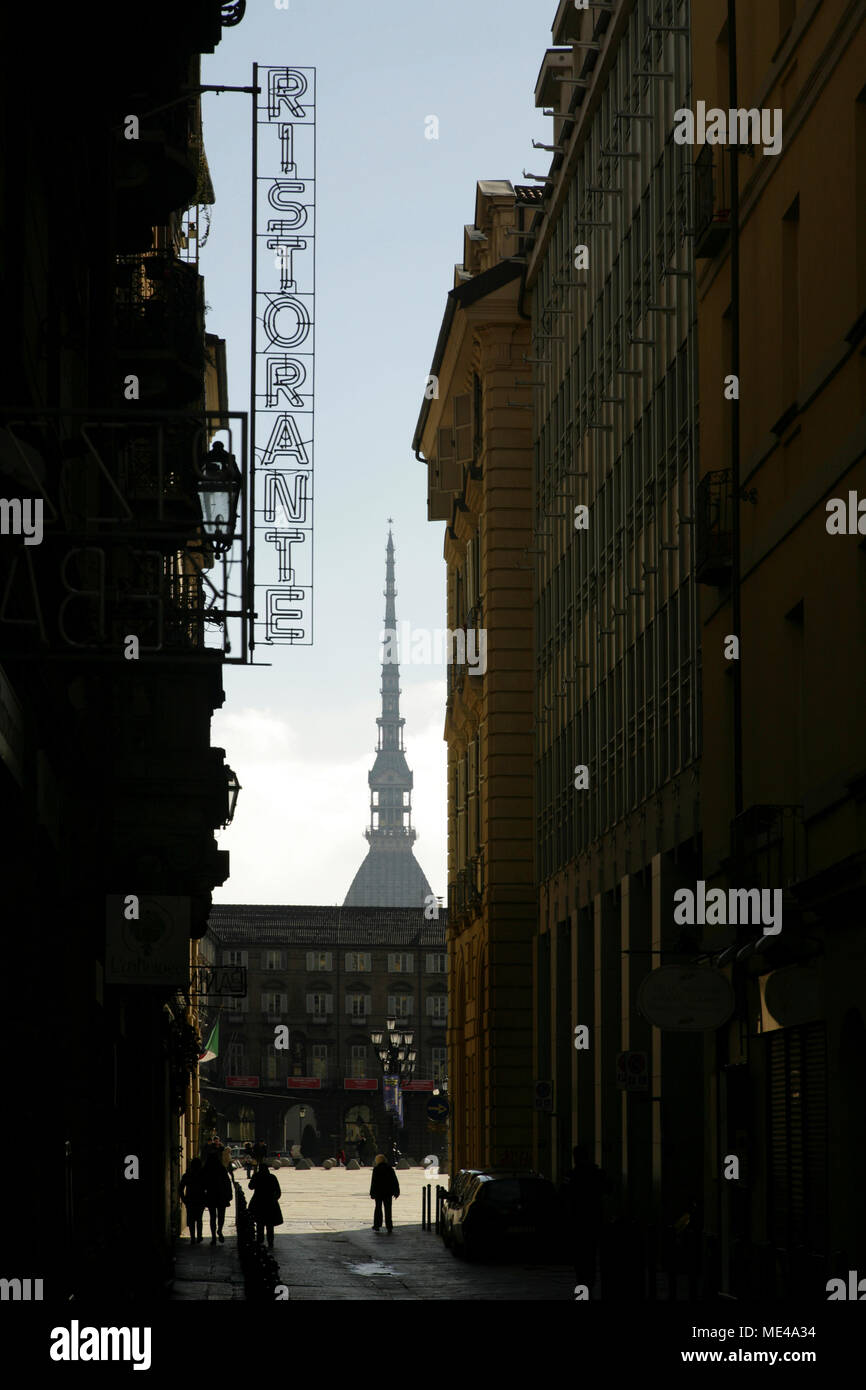 Restaurant sign and the top of the Mole Antonelliana, Turin, Italy. Stock Photo